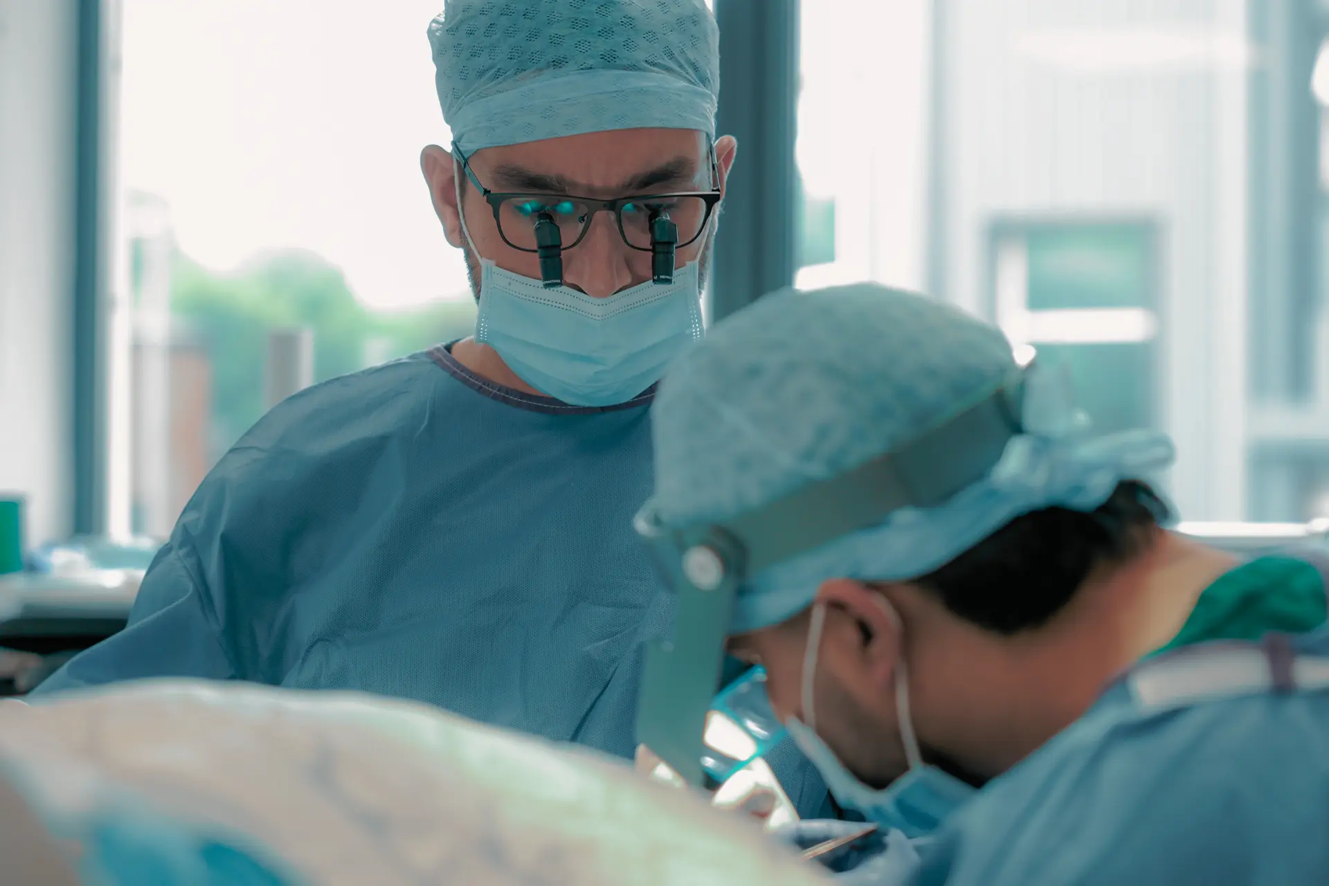 Surgeons performing a hair transplant procedure at Dr. Raja Hair Restoration in Leeds